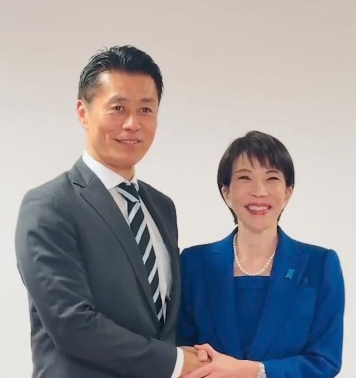 高市早苗と握手をする細野豪志